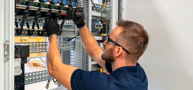 a man working on an electrical panel